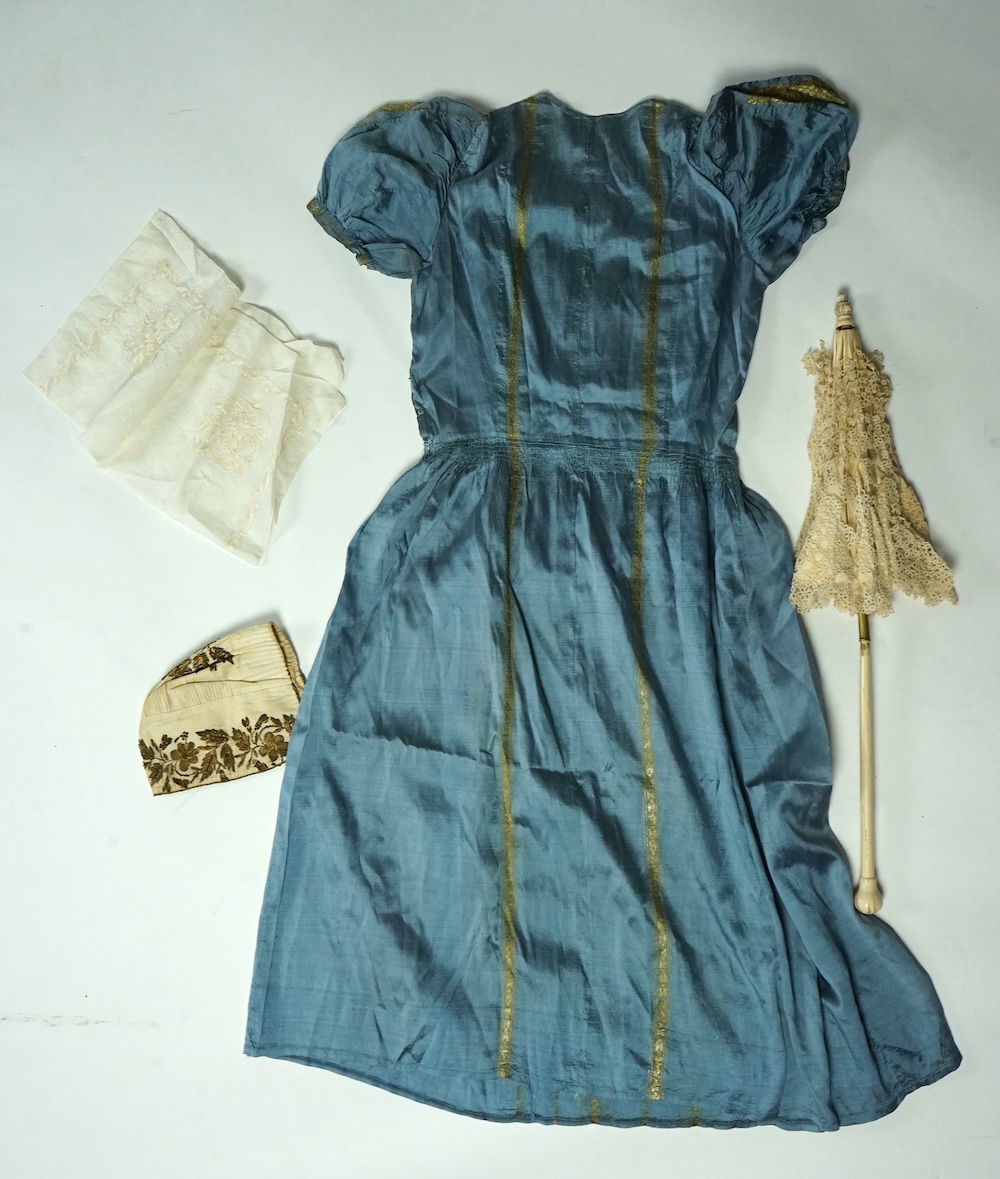 An early 19th century cream silk and metal thread embroidered ladies bonnet, an interesting 1930’s blue silk and gold thread dress fabric designed with Secessionist influences, an earlier fine linen silk embroidered kerc